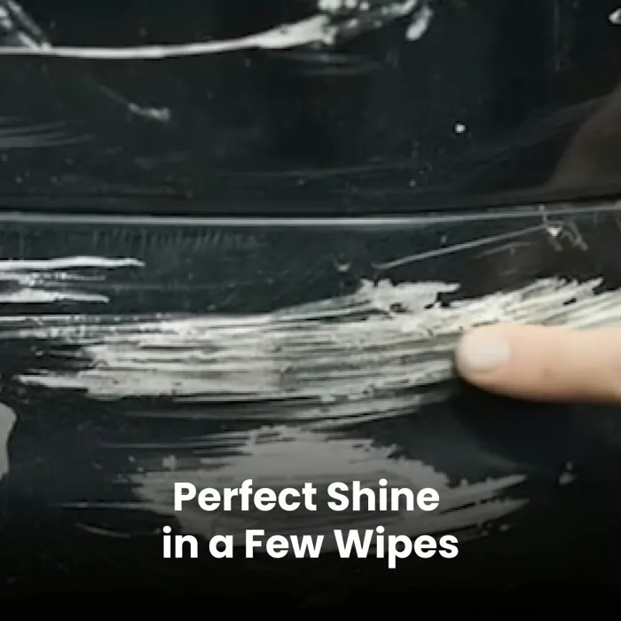 Finger pointing at light white scratches on dark car paint before using NanoPolix, brand photo